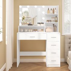 a white vanity with lights on it in a room next to a bed and window