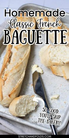 homemade classic french baguette recipe on a baking sheet with a knife and butter