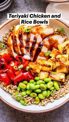 a bowl filled with rice, meat and veggies on top of a table