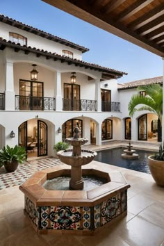 a fountain in the middle of a courtyard