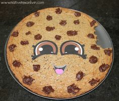 a cookie with chocolate chips and eyes on it