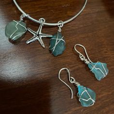 Nwot Unique Hawaiian Genuine Seaglass Jewelry This Is A Three Piece Sterling And Sea Glass Set, Featuring Earrings, Bracelet, And The Necklace All In Genuine Sterling Silver. The Necklace Is A Box Link Chain, And The Bracelet Is Adjustable. Earrings Are Dangly And Pierced Only. This Is A Beautiful Gift That I Was Never Able To Wear So My Loss Is Your Gain Wire Wrapped Silver Sea Glass Necklaces, Ocean-inspired Silver Necklace With Recycled Glass, Ocean-inspired Turquoise Sea Glass Jewelry, Ocean-inspired Silver Glass Necklace, Jewerly Ring, Adjustable Ocean-inspired Sea Glass Jewelry, Pirate Jewelry, Seaglass Jewelry, Sea Glass Ring