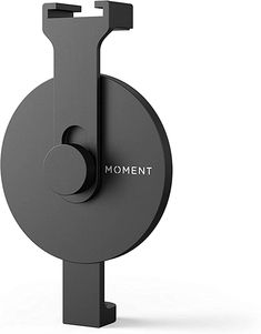 a black object with the word moment on it