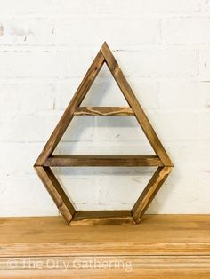 a wooden shelf sitting on top of a wooden table