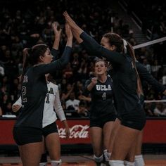 the volleyball team is celebrating their victory