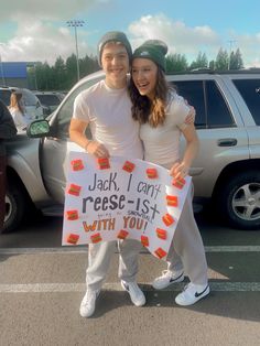 a man and woman standing next to each other holding a sign that says jack i can't reese - list with you