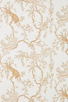 the wallpaper is gold and white with birds on branches, flowers, and leaves