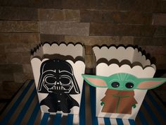 two star wars themed treat boxes on a table