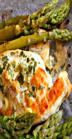 chicken and asparagus on a plate with sauce