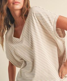 This soft and comfy t-shirt features a chic stripe pattern, a v-neckline and short sleeves. A wardrobe staple that is always in style and always cute! 100% cotton Model is wearing a size small and is 5'8" FINAL SALE - CANNOT BE RETURNED OR EXCHANGED Striped Cotton V-neck T-shirt, Beige Tops With Vertical Stripes For Summer, Vertical Stripes Short Sleeve Top For Day Out, Chic Striped T-shirt For Summer, Spring V-neck Top With Vertical Stripes, V-neck Top With Vertical Stripes For Spring, V-neck Tops With Vertical Stripes For Spring, Casual Striped V-neck Top, Beige Relaxed Fit V-neck T-shirt