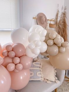 balloons are arranged on the back of a chair