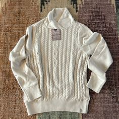 Brand New Old Ranch Cream Sweater With Classic Fisher Knit Design With Unique Neckline Fitted Winter White Sweater For Fall, Fitted Beige Cable Knit Sweater, Classic Cream Tops For Winter, Cozy Cable Knit Winter White Tops, Fitted Beige Sweater With Ribbed Collar, Beige Fitted Sweater With Ribbed Collar, Cozy Fitted Cotton Sweater, Cozy Fitted Top With Ribbed Collar, Fitted Classic Sweater In Winter White