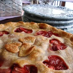 a strawberry pie sitting on top of a table