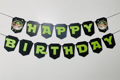 a happy birthday banner hanging from a string