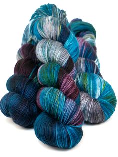 several skeins of blue and green yarn