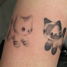 two tattoos on the legs of people that have cats and kittens painted on them