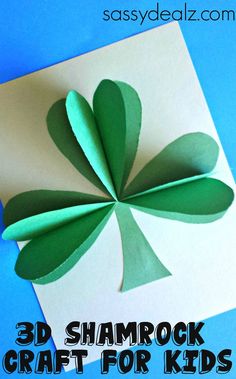 an easy st patrick's day card made out of paper and cut into four leaf clover shapes