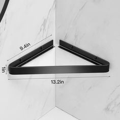 the measurements for an angled door handle are shown in black on a white marble background