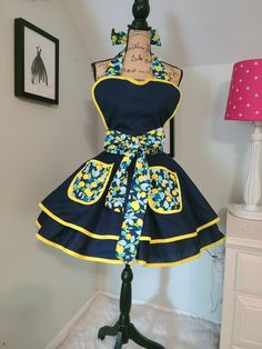 a mannequin dressed in a blue and yellow dress