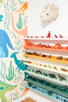 colorful dinosaur wallpaper in a children's room