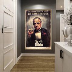 a hallway leading to a bathroom with a poster on the wall that says, the gunmaker he can't refuse