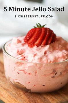 strawberry jello salad in a glass bowl with strawberries on top and text overlay reading 5 minute jello salad