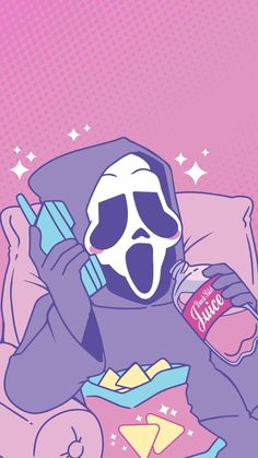 a person in a hoodie holding a drink and sitting on a couch with food