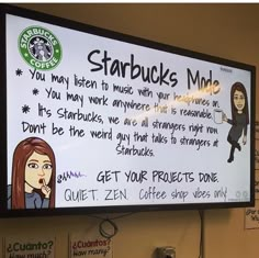 a starbucks advertisement on the wall above a coffee shop's menu board that reads, starbuckss made you may listen to music with your headphones