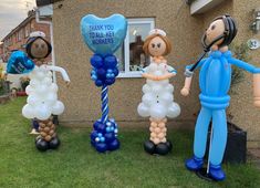 three inflatable balloon figures are standing on the lawn