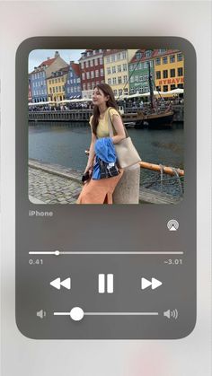 an iphone screen with the image of a woman holding a blue bag