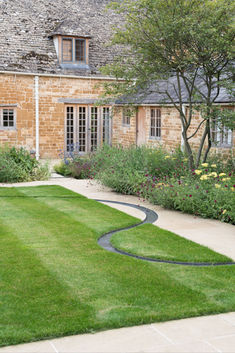 a house that has some grass in front of it