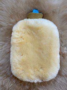 "Sheepskin Hot Water Bottle Warmer , Ovulation Relief, Stress Reducer, Sheepskin hot water bottle cover, Natural Pain Relief  Size: 11\" x 8\" Medical grade natural sheepskin bottle warmer with a bottle included. Using a hot bottle for various ailments is an ancient tradition across the world. Our hot bottle warmer is nestled in a beautiful natural sheepskin, which keeps the water sustaining at an ideal heat while also being healing and cozy to the touch. Ways to use a sheepskin hot bottle warme Sheepskin Blanket, Large Sheepskin Rug, White Sheepskin Rug, Sheepskin Gloves, Hot Water Bottle Cover, Water Bottle Covers, Sheepskin Slippers, Bottle Warmer, Natural Pain Relief