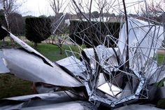 a large metal sculpture sitting in the middle of a park