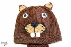 a crocheted hat with a bear's face on it