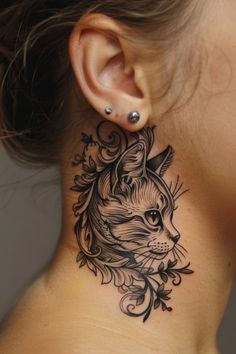 a woman with a cat tattoo on her neck and behind her ear is a flower