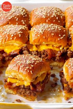 cheeseburger sliders are piled on top of each other with melted cheese and chili