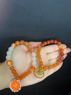 Handmade Orange Spiritual Beaded Bracelets, Orange Spiritual Jewelry With Colorful Beads, Spiritual Orange Stretch Bracelet, Spiritual Orange Gemstone Bracelets, Orange Hand-strung Spiritual Bracelets, Beads, Quick Saves