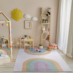 a child's playroom with toys and decor in pastel pinks, yellows, and greens