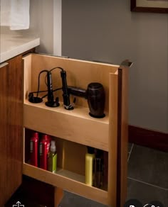 a wooden cabinet with various items in it