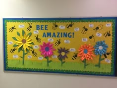 a bulletin board with flowers and bees on it