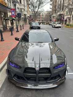 a black sports car parked on the street