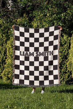 a black and white checkered blanket that says i am smith