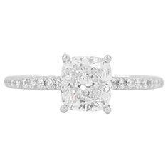 Tiffany & Co. NOVO Platinum Cushion Brilliant Cut Diamond Engagement Ring 1.49 ct Total Weight. The ring weighs 3.5 grams, size 8.5 (can be resized to most finger size), the center stone is a 1.33 ct Novo Cushion Brilliant Cut Natural Diamond, H in Color, VS1 in Clarity, Excellent Cut, Polish & Symmetry 6.48x5.98x4.05 mm. The Center diamond is laser inscribed with "T&Co.T0517****" on the crown. The "Novo" Cushion cut is only cut & sold by Tiffany & Co, it's stunning looking & is a very rare diamond cut! There are 20 Natural Round brilliant cut side diamonds weighing 0.16 ct, with D-G in color, IF-VS2 clarity. The Engagement ring is stamped "©TIFFANY&Co. PT950." and "6342**** D1.33 CT". The Current retail price for this ring ~$23,500+ Tax. In like-new condition. The ring comes with the Tiff Brilliant Cut Diamond Engagement Ring, Rare Diamond, Tiffany And Co, Jewelry Rings Engagement, Ring Box, Cushion Cut, Brilliant Cut Diamond, Tiffany & Co., Ring Verlobung