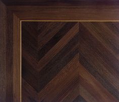 an image of a wooden frame with chevron pattern on the bottom and sides in dark wood