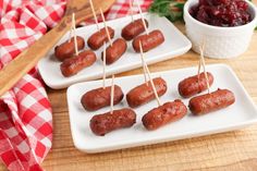 small appetizers with toothpicks and cranberry sauce