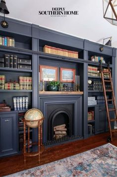 a living room with blue bookcases and a ladder in the middle of it