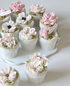 there are many cupcakes that have flowers on them