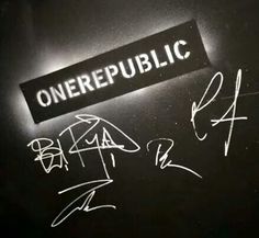 some writing on a black wall and one is written in white ink with the word,'onerepublic '