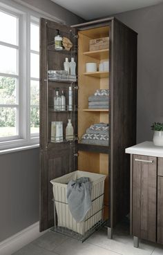 an open cabinet with towels and other items in it