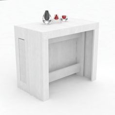 a white table with two silver objects on it's top and one red object at the end